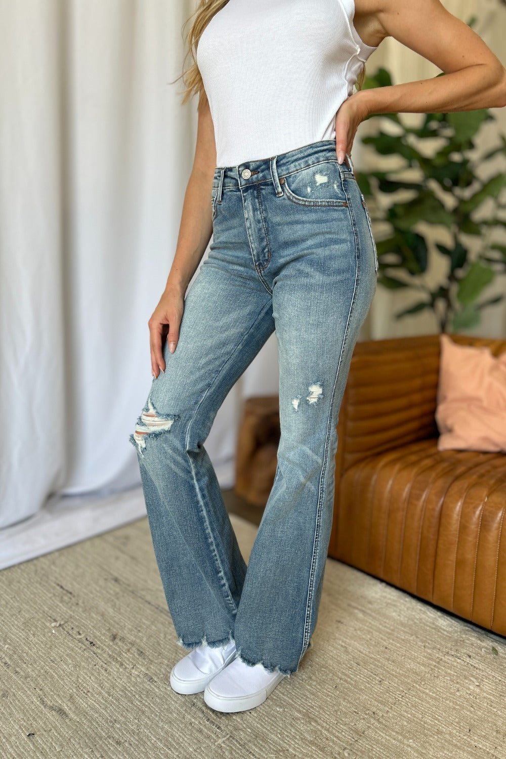 Mid Rise Flare Cut Distressed Jeans in Medium Wash