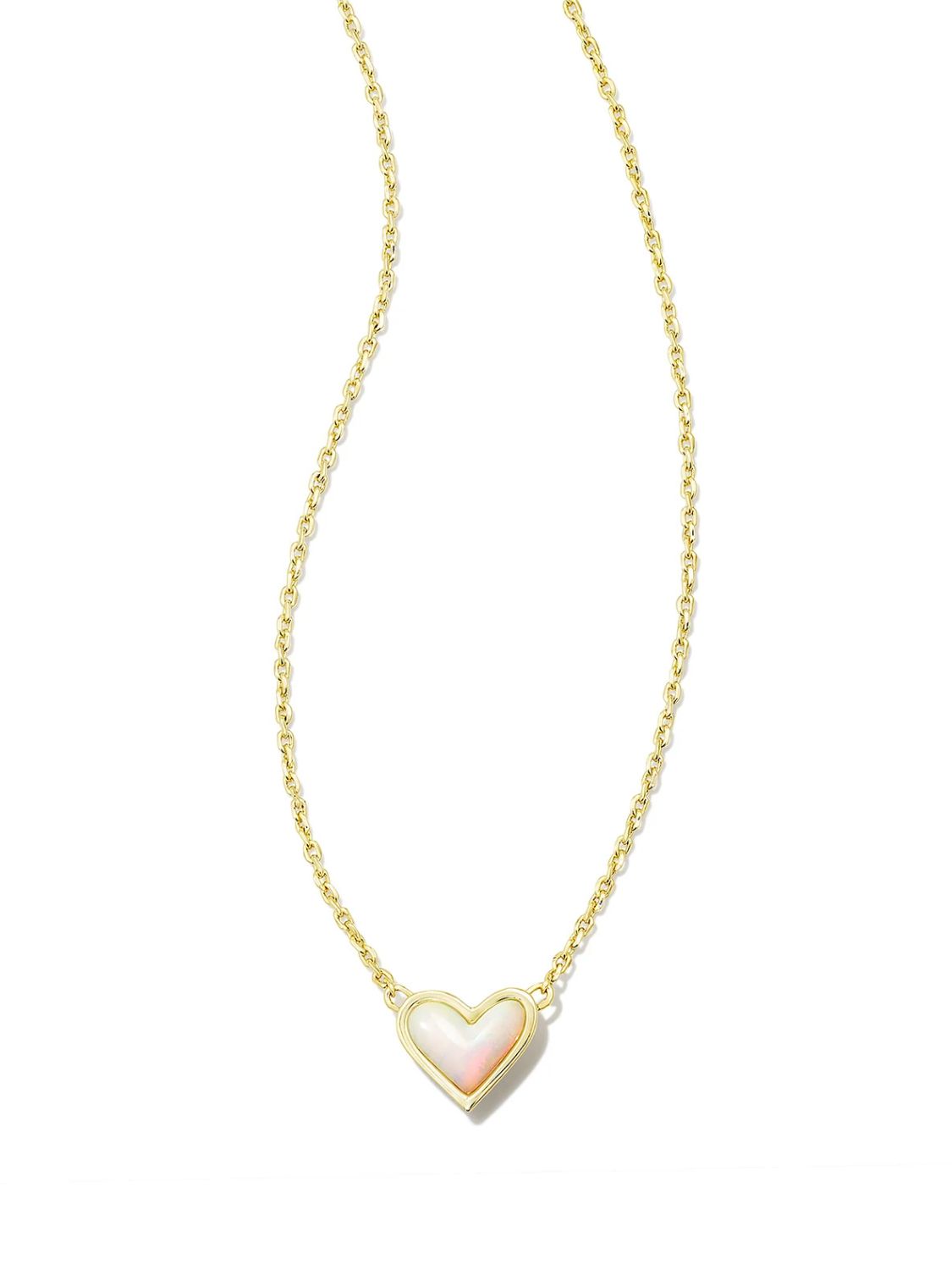 Gold necklace with a white heart-shaped pendant on a white background